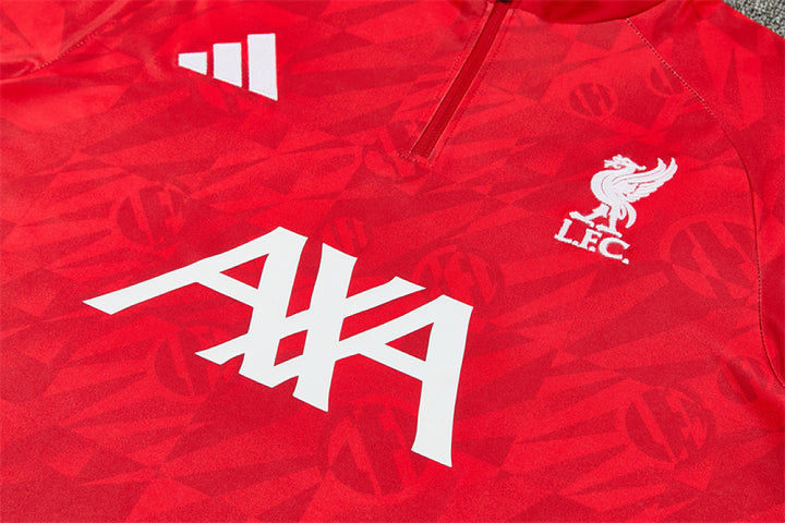 AXA sponsor print and Liverpool crest detail on red training top