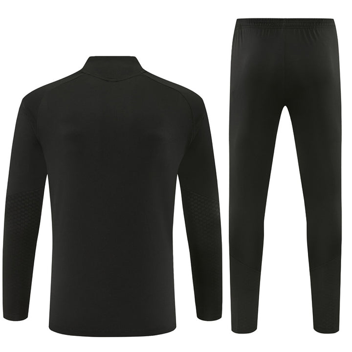 Manchester United blackout tracksuit 2026/27 back view black training top and joggers