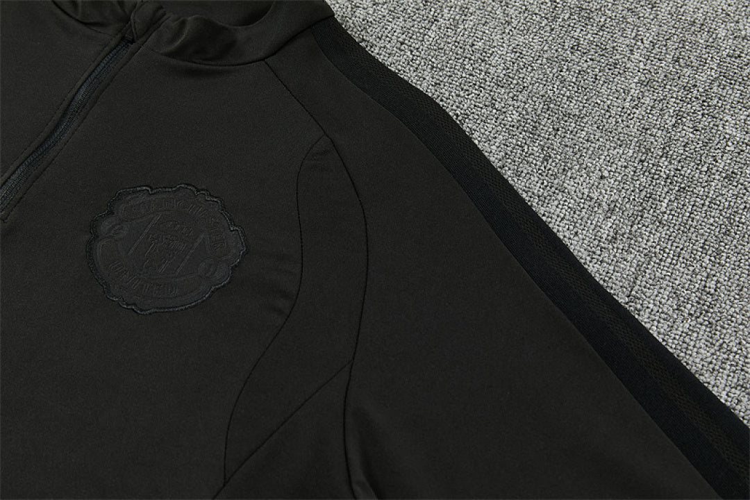 Tonal Manchester United crest and raglan seam detail black tracksuit