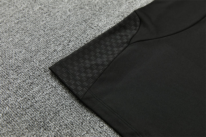 Hem and side panel detail Manchester United black tracksuit