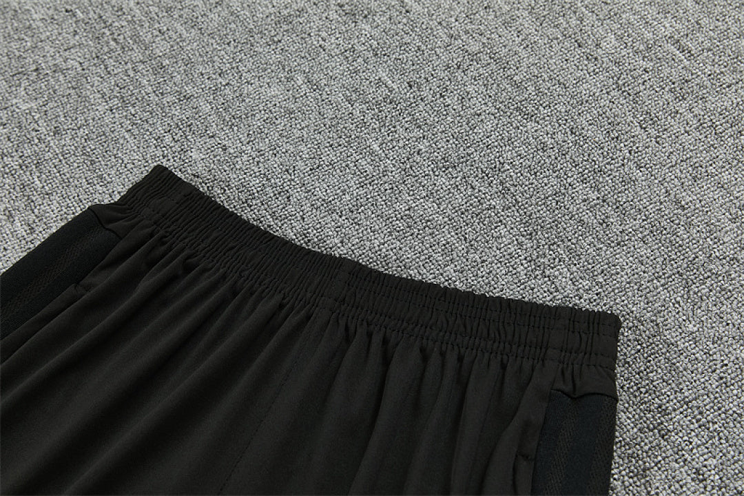 Elastic waistband and side pocket detail Manchester United black track pants