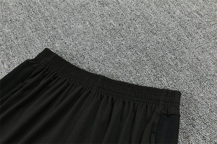 Elastic waistband and side pocket detail Manchester United black track pants
